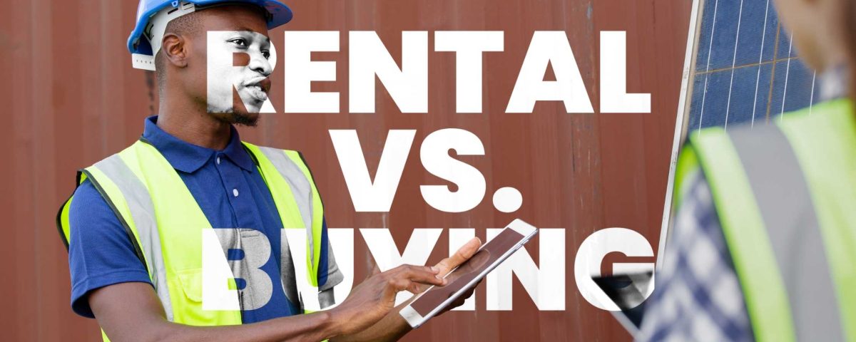 A solar installer in a safety vest and helmet discusses a rent solar system contract with a client near a solar panel installation.