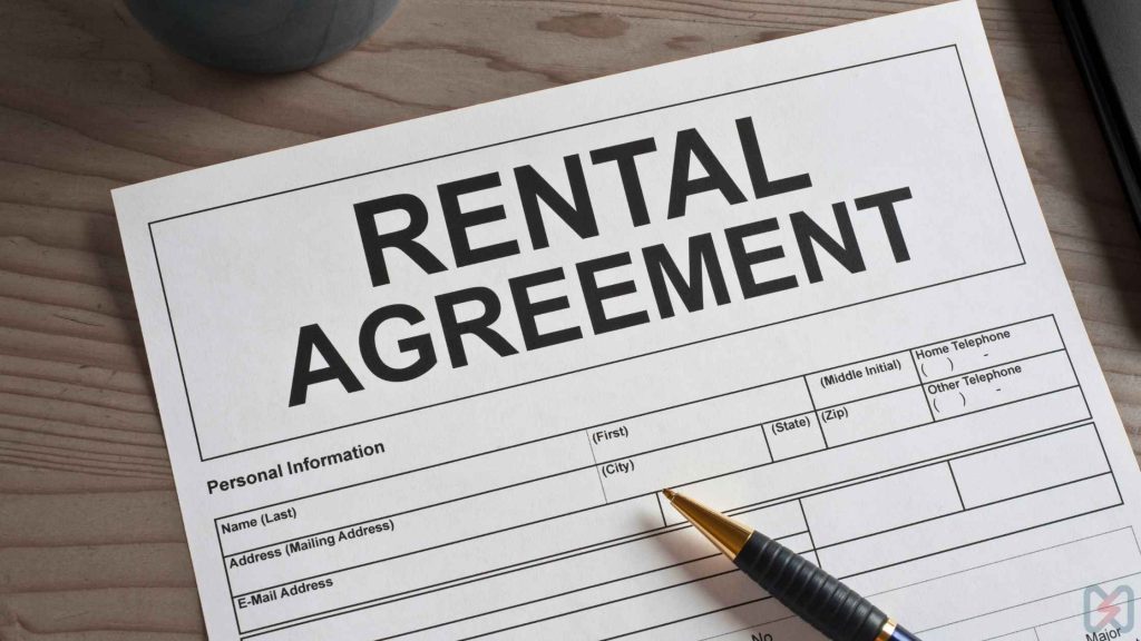 A rental agreement document with a pen, illustrating the contract terms and conditions of a rent solar system lease.