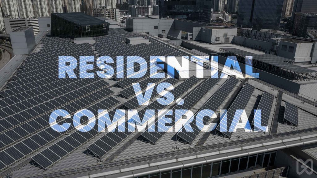 An aerial view of a large rooftop solar installation comparing residential and commercial rent solar system options.